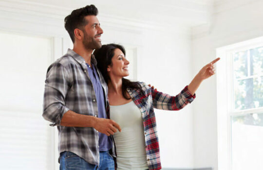 Couple viewing inside of house