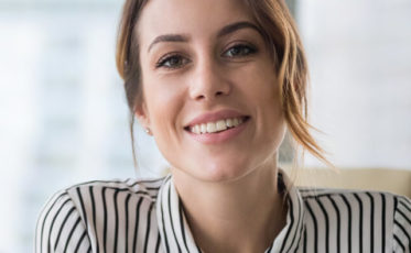 Female mortgage specialist smiling in an office