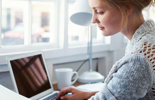 Woman reading first home documents