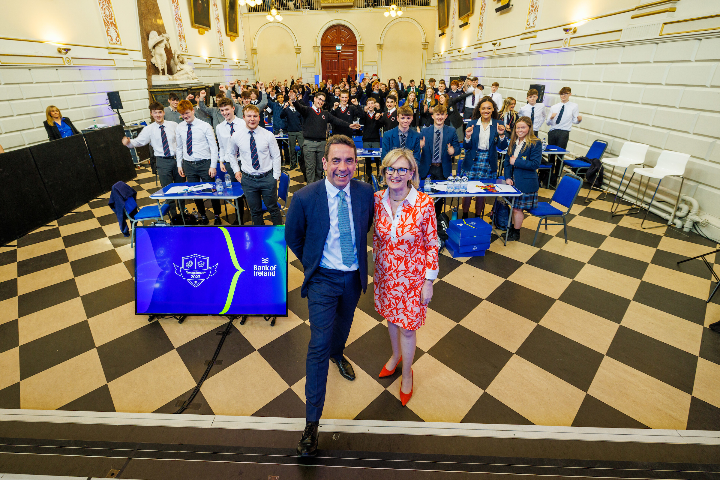 Myles O’Grady (CEO) and Mairead McGuinness (European Commissioner) alongside all 16 teams competing in the Money Smarts Quiz Challenge Grand Final in Trinity College Exam Hall, 12 May 2023.