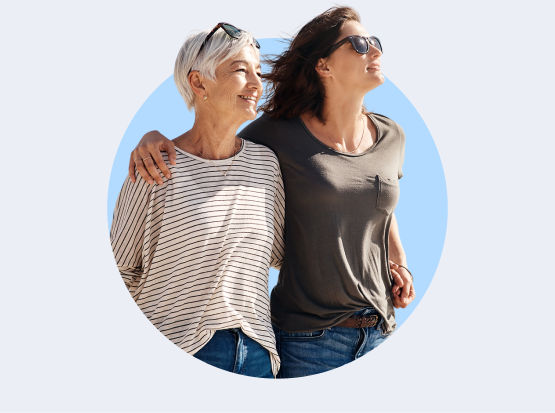 Two women with their arms around eachother.